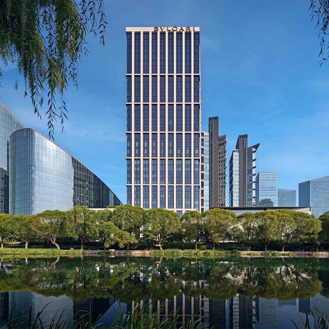 Bvlgari Hotel Beijing and riverside gardens reflected in the Liangma River