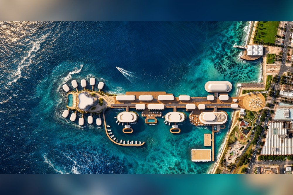 Aerial architectural rendering of the proposed Cunningham Pier precinct extending into Corio Bay, with buildings, villas, promenades and floating recreation spaces.