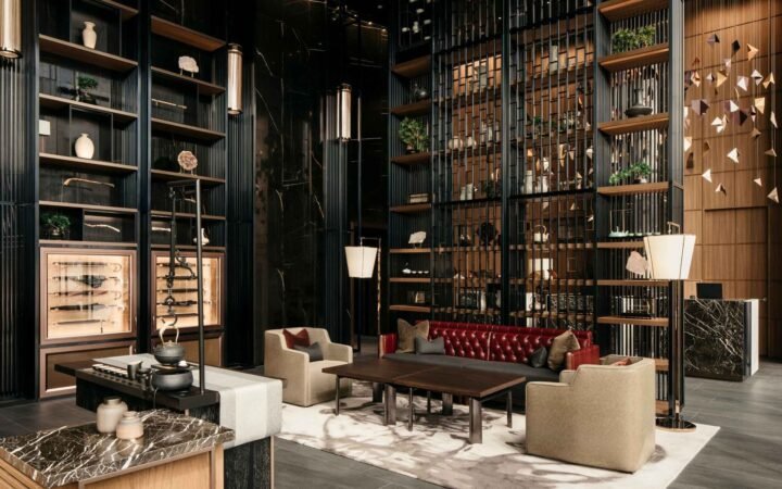 Lobby seating and decorative shelving at The Clan Hotel Singapore