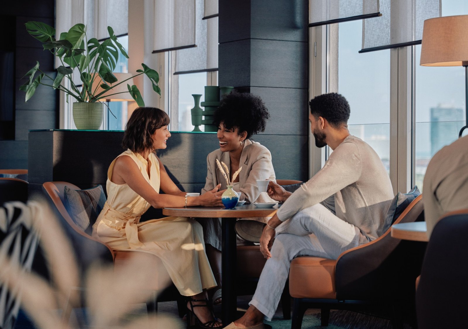 Three guests meeting in the executive lounge at Hilton Vienna Waterfront